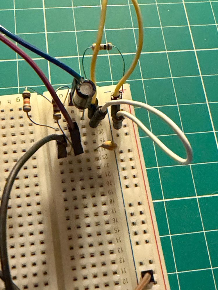 The first circuit on a breadboard: resistors, capacitors and jumper wires.